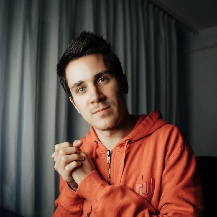 Avery Chen, Lead Design Curator at Valley Vivid Vista, reviewing corporate floral arrangements